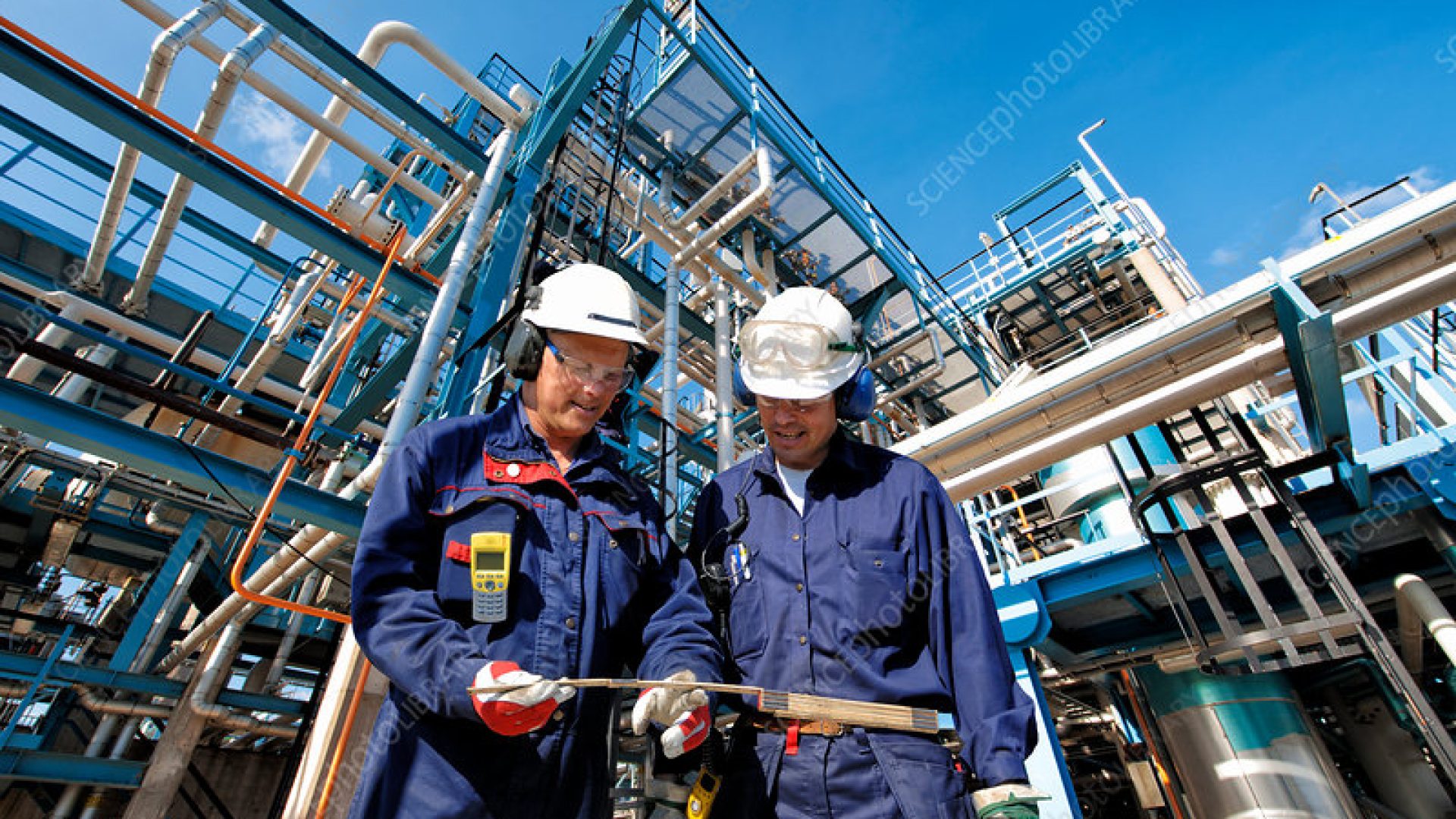 Oil and gas workers at refinery.